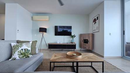 Master bedroom with floor-to-ceiling windows offering Pacific Ocean views in PH Royal Palm Playa Gorgona