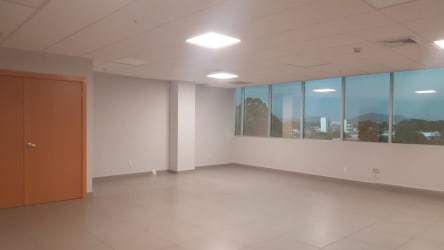 Bright hallway with tiled floor and multiple office doors at PH International Insurance Tower David Panama