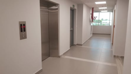 Hallway with elevator access and modern lighting in PH International Insurance Tower David Panama