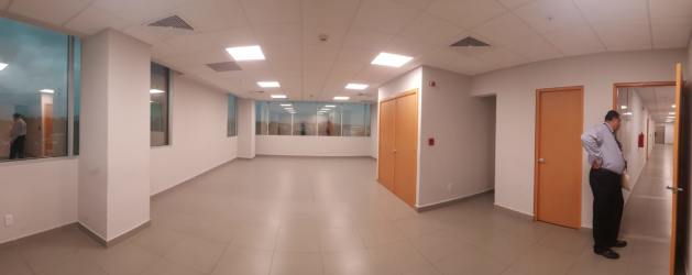 Open office room with tiled flooring and sunshine in PH International Insurance Tower David Panama