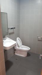 Minimalist bathroom with sink and toilet inside PH International Insurance Tower David Panama