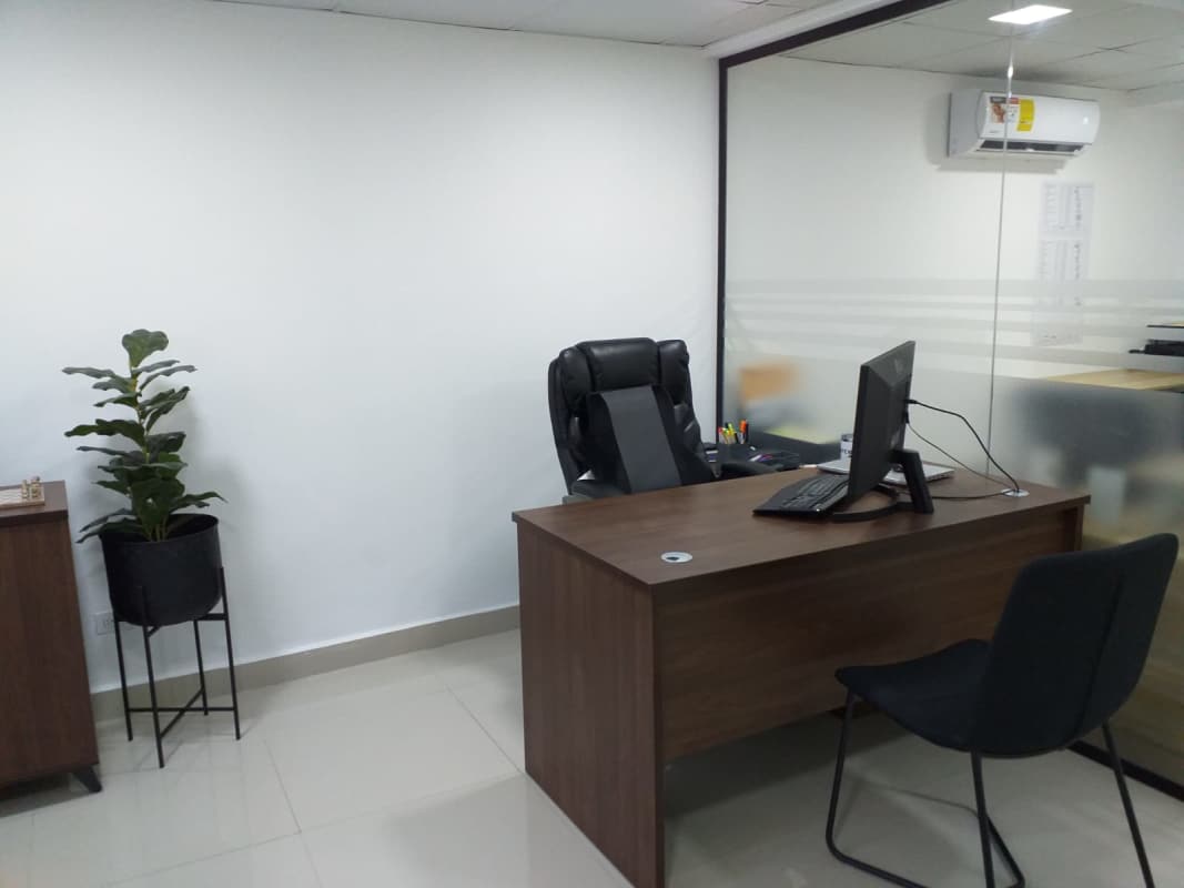 Waiting area sofa, glass whiteboard, window Betania Panama