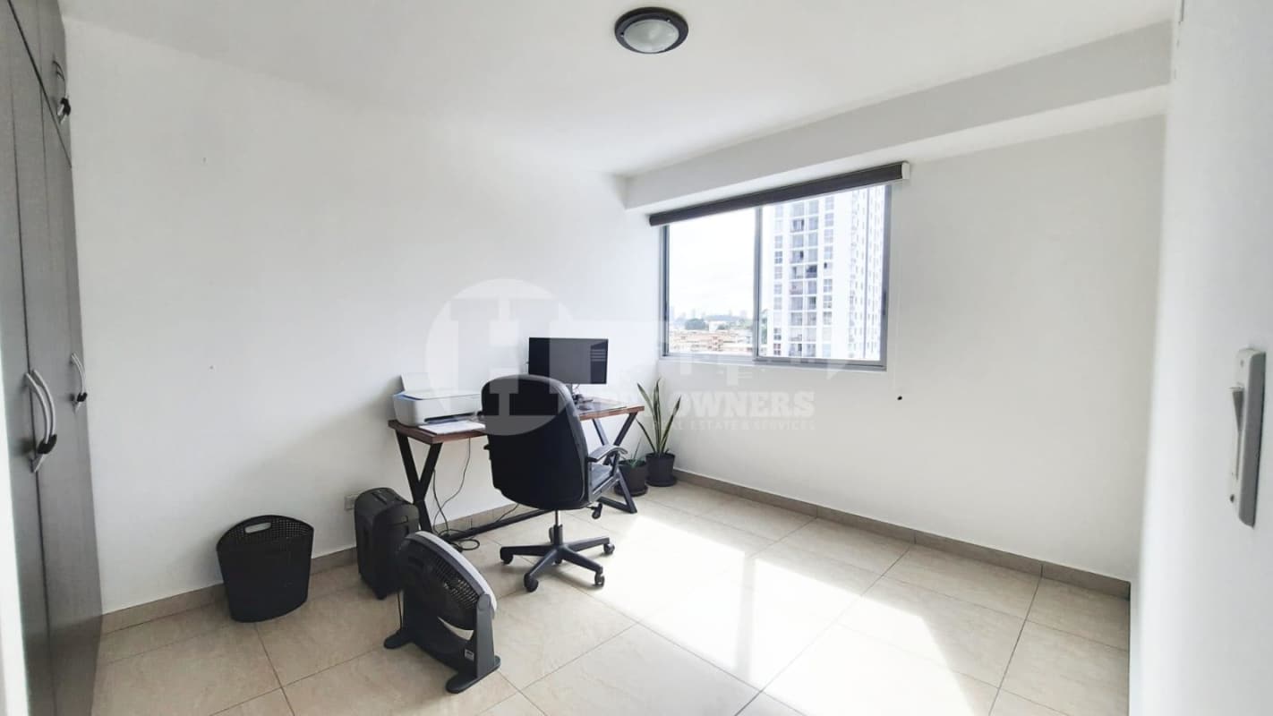 Minimalistic work space with built-in closet window tile floors apartment Vista Park Panama