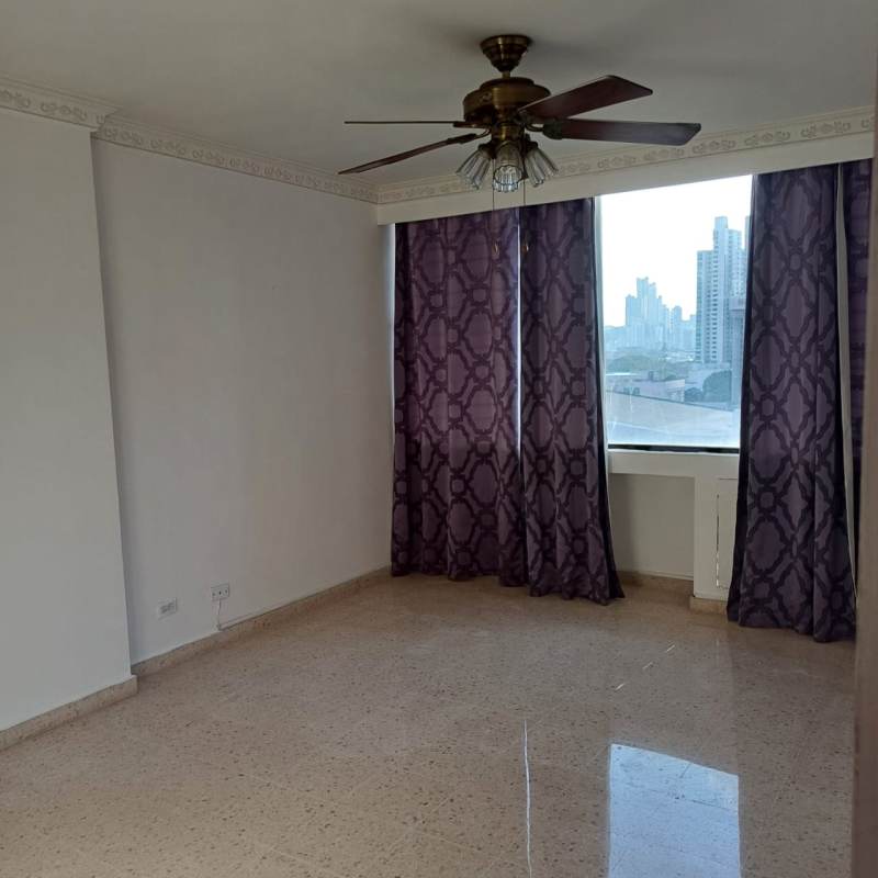 Bedroom with large window, city and ocean views, ceiling fan PH Grand View Tower Panama City