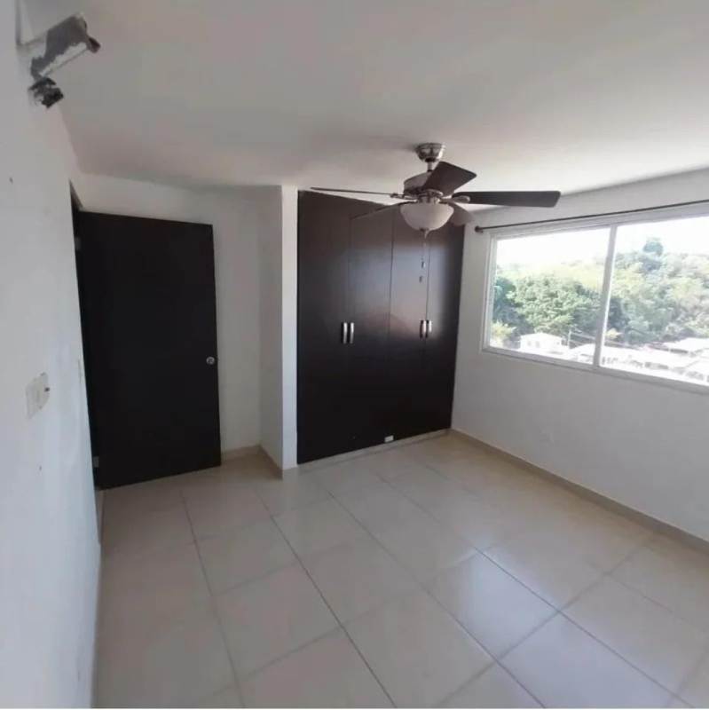 Bedroom with built-in wardrobe, ceiling fan, tile floor in PH Altos de Panamá Condado del Rey Panama