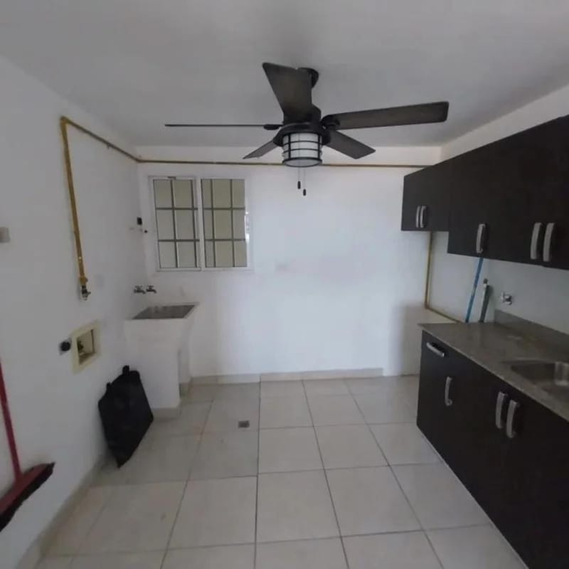 Laundry room with utility sink and cabinets PH Altos de Panamá Condado del Rey Panama