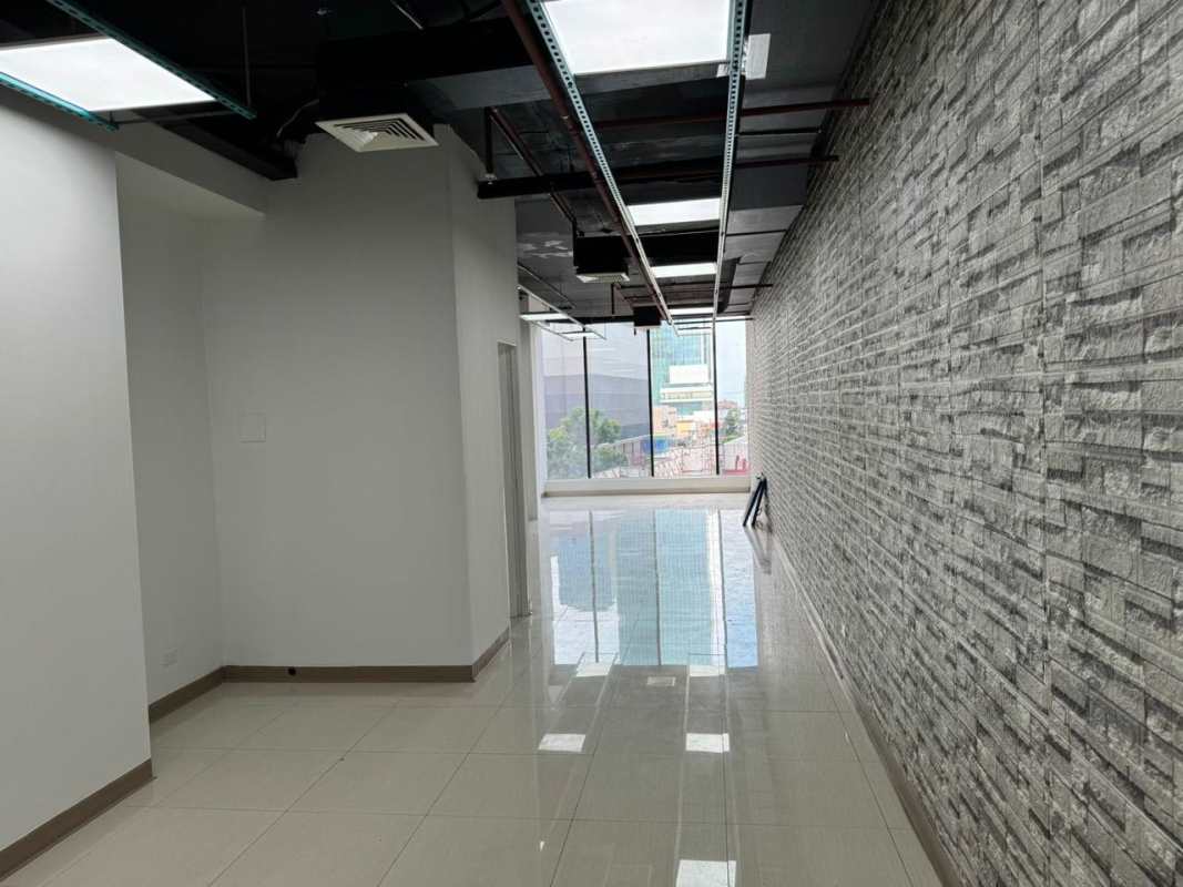 Industrial style empty commercial office with large windows and tiled floors at Punta Paitilla Panama