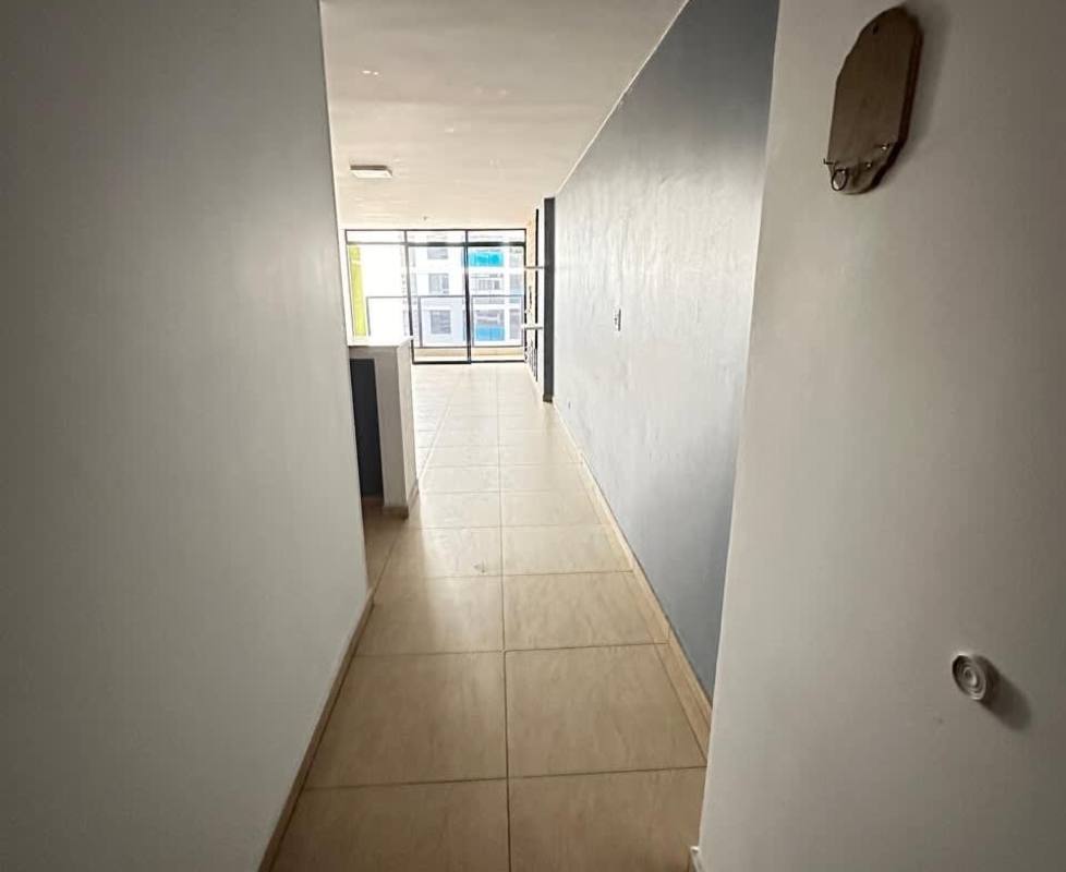 Open modern kitchen with granite countertops, wood cabinets, breakfast bar PH Terrazas del Rey Condado del Rey Panama City