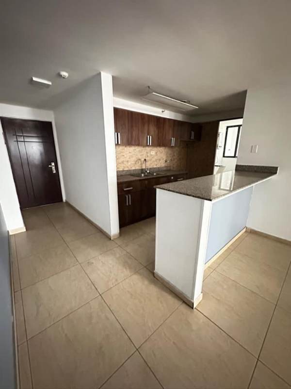 Bright living room with sliding glass doors to balcony in PH Terrazas del Rey Condado del Rey Panama City