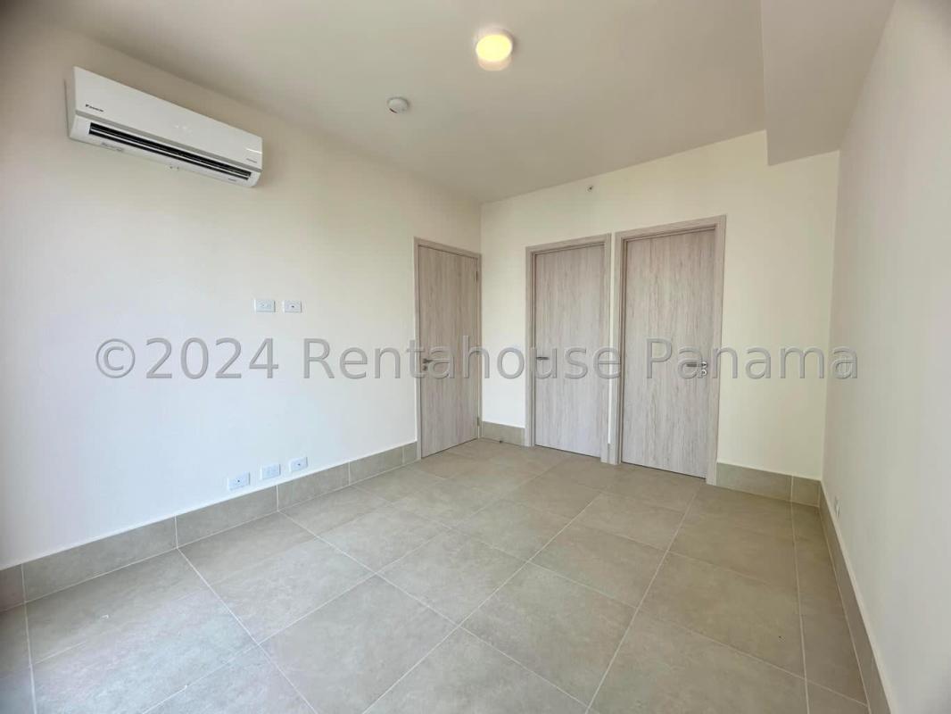 Modern infinity swimming pool with sun loungers at Santa Maria Panama