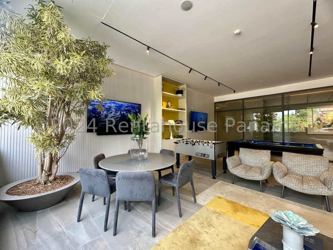 Rooftop blue sports padel court enclosed with mesh and skyline view