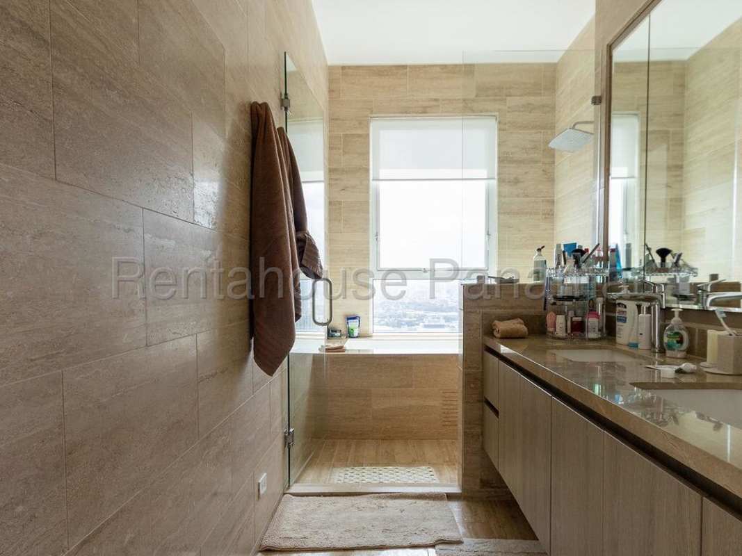 Grand living and dining space with marble floors ocean view balcony PH Aria Costa del Este