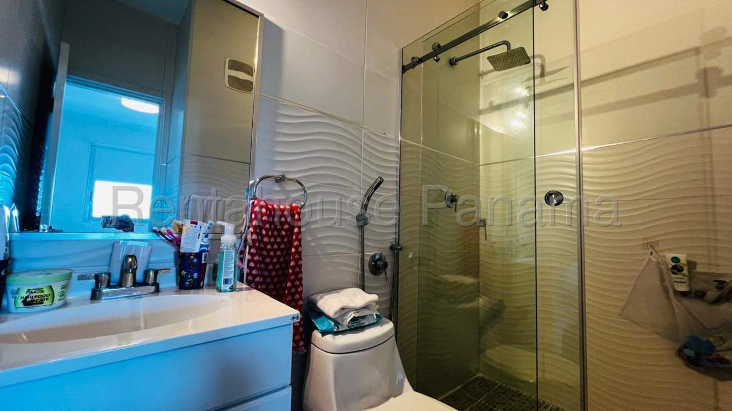 Modern bathroom with glass-enclosed shower and elegant fixtures PH Keops San Francisco Panama