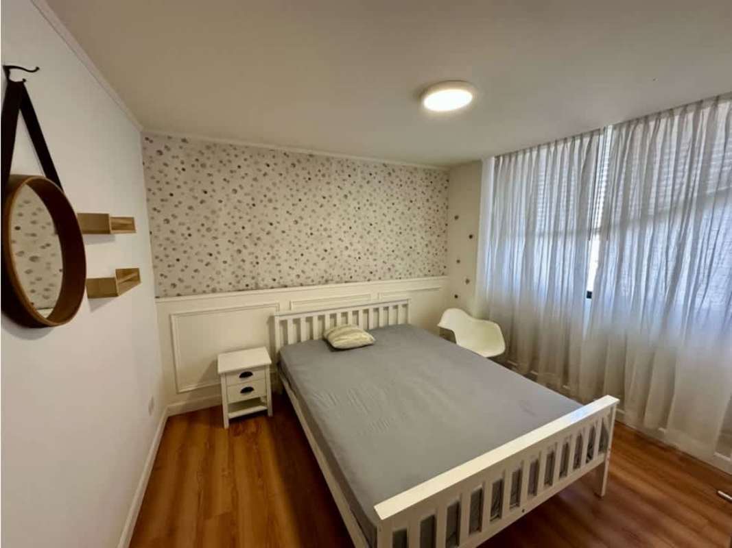 Contemporary bathroom with black tiles, glass shower in PH Campo Alegre Panama