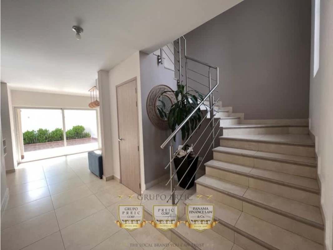 Modern kitchen with granite countertops, built-in oven, glass cabinets and appliances in Versalles duplex Panama