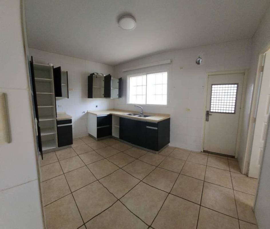 Modern kitchen with white cabinets large window PH Alpes Paseo del Norte Brisas del Golf Panama