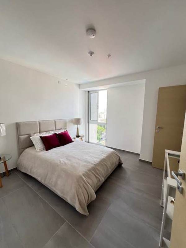 Bright new kitchen with oven, stove and wood cabinetry in PH Midtown Panama City