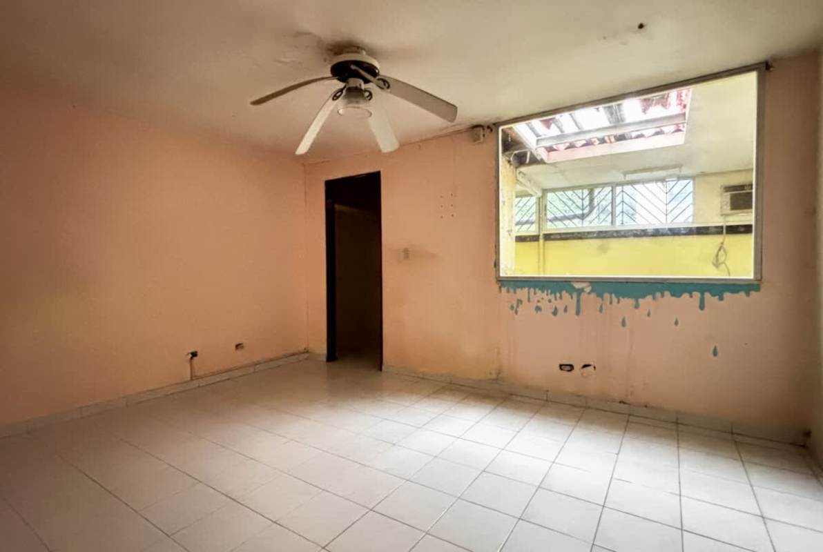Empty living room space with tiled floors and balcony sliding doors PH Altos de Bella Vista Panama
