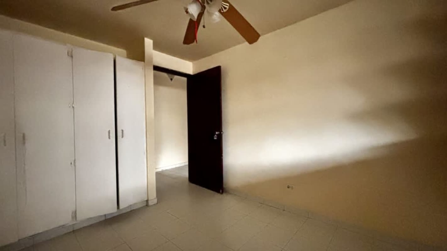 Empty bedroom with tile floor, ceiling fan, and closet PH Altos de Bella Vista Panama