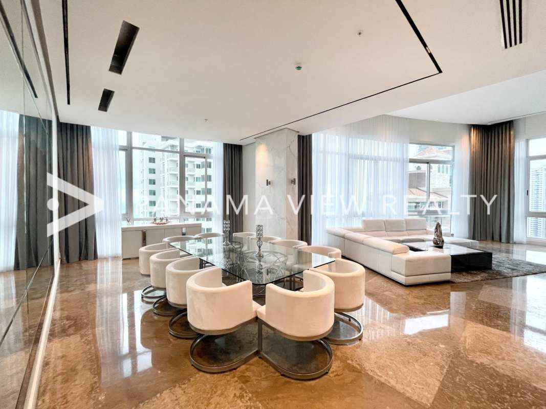 Spacious living-dining room with marble floors, aquarium, panoramic windows at PH Blue Bahia