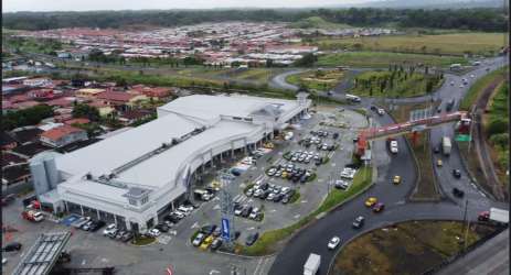 Exterior facade with signage and parking exterior commercial retail space Zona Libre Colon Panama
