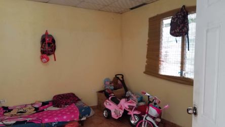 Rustic kitchen with tile counters and breakfast bar in countryside estate for sale Panama