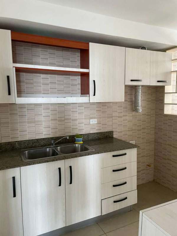 Modern kitchen featuring granite counters and cabinetry in PH San Francisco Bay Panama