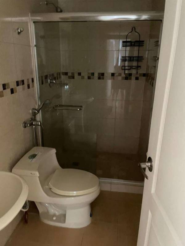 Bathroom with glass shower enclosure and modern tiles in PH San Francisco Bay Panama