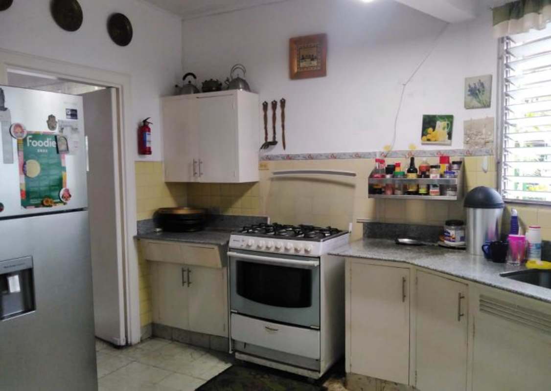 Living dining open space with eclectic furniture garden view waterfront Coco del Mar Panama