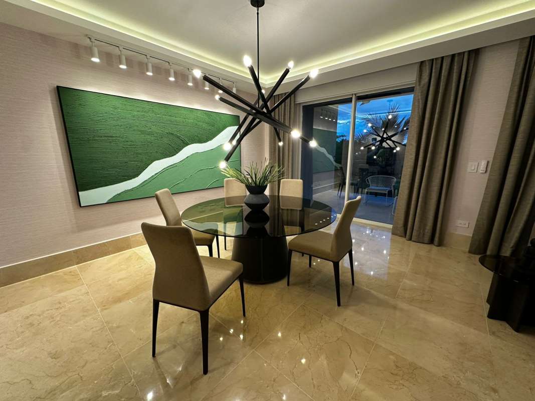 Spacious dining area with contemporary chandelier marble flooring The Reserve Panama