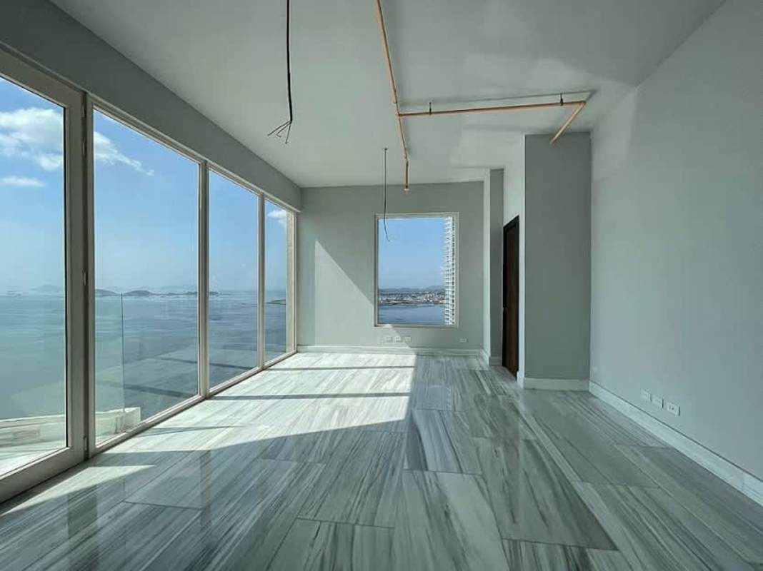 Modern living area with marble floors, panoramic ocean views PH The Towers Punta Paitilla