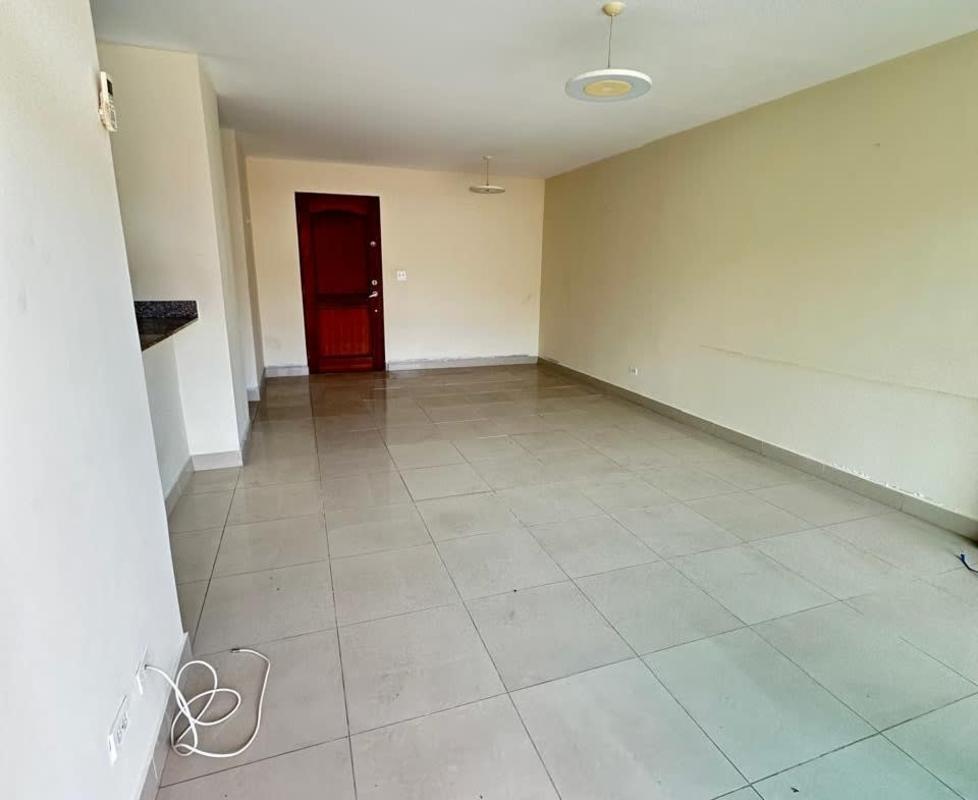 Spacious living room with tile floors and open kitchen at PH Sun City Albrook Panama City