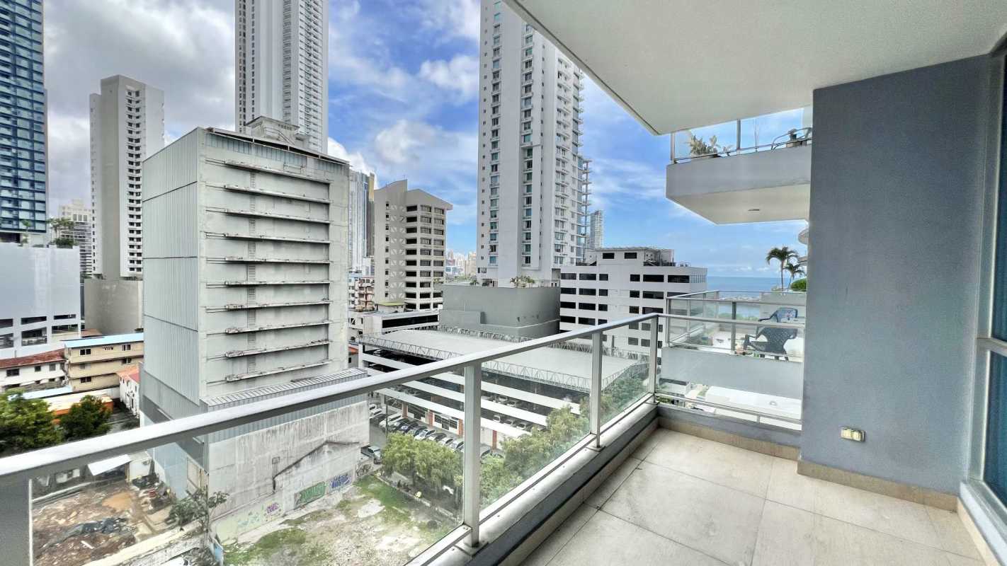 Private balcony with glass railing panoramic ocean and skyline views in PH Vista Balboa Panama