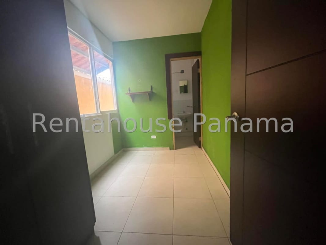 Living room with tile floors and large windows in Villa Tivoli Brisas del Golf Panama