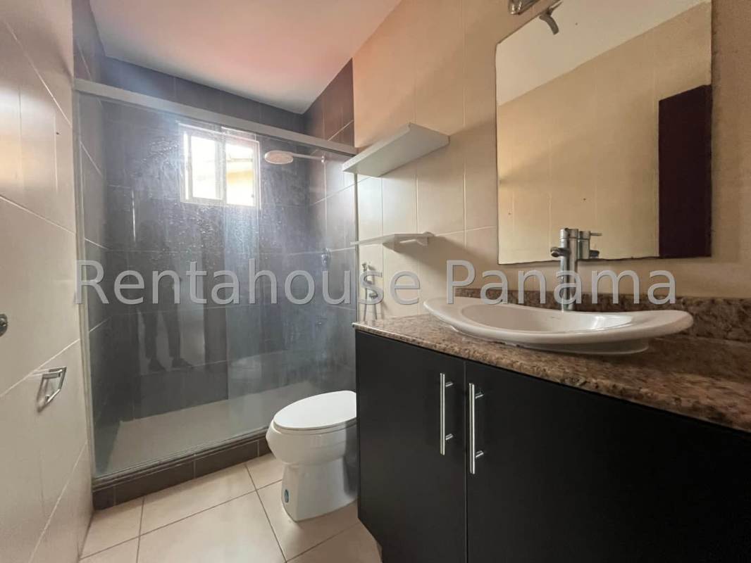 Contemporary bathroom with granite countertop vanity and glass shower Villa Tivoli Panama