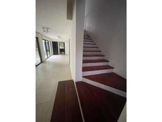 Spacious bright living room with large windows and garden view PH Nativa Panama Pacifico house for rent