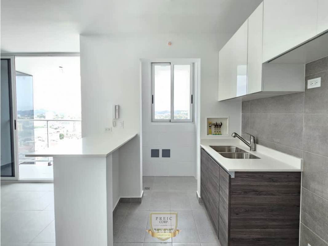 Modern kitchen with balcony, breakfast bar dark wood cabinets in new condo PH Park Square Panama City