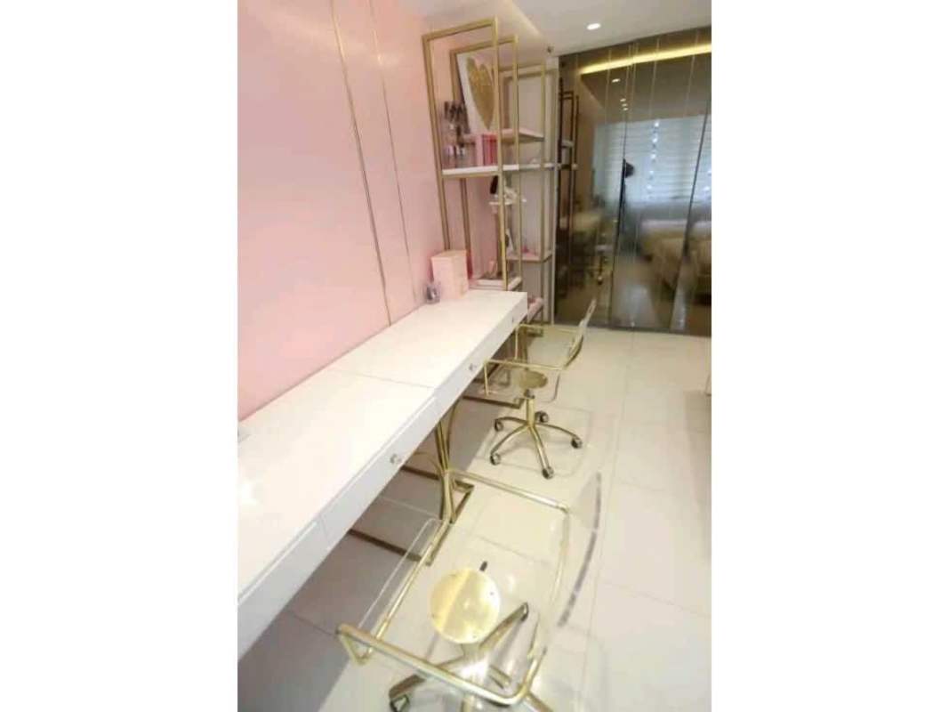 Elegant built-in workspace with pink accents in apartment PH Tamanaco Panama City