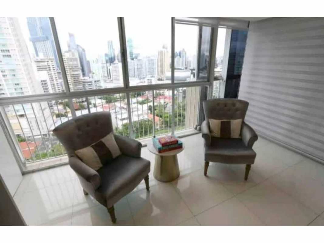 Large open living room with modern decor, windows with city views in Punta Paitilla Panama