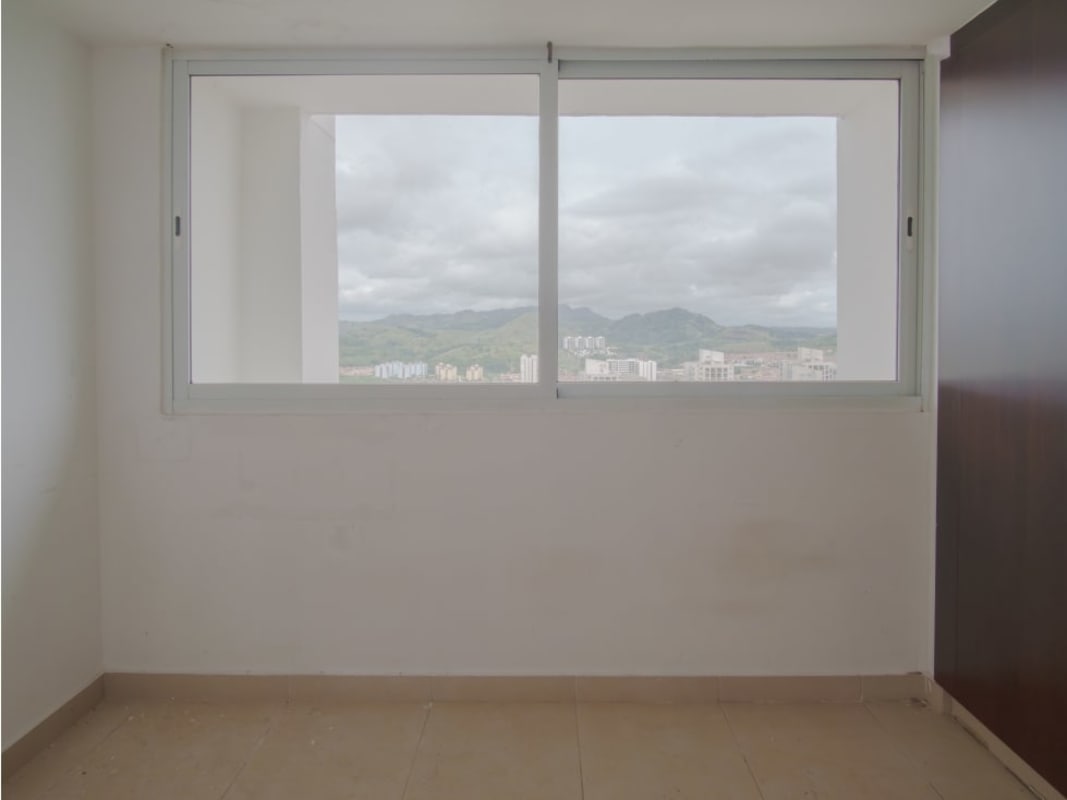 Bedroom with tile floor, large window, mountain and skyline view PH Kings Park Panama