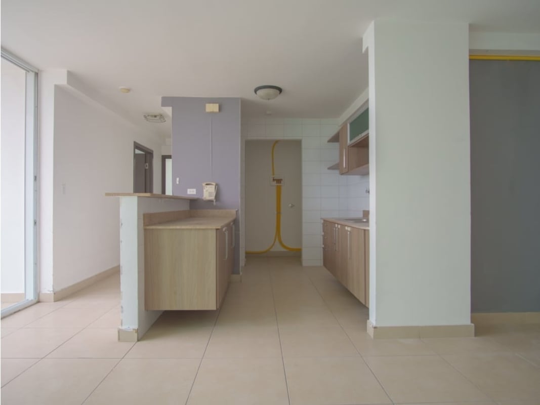 Spacious living-dining with large sliding glass doors to balcony PH Kings Park Condado del Rey