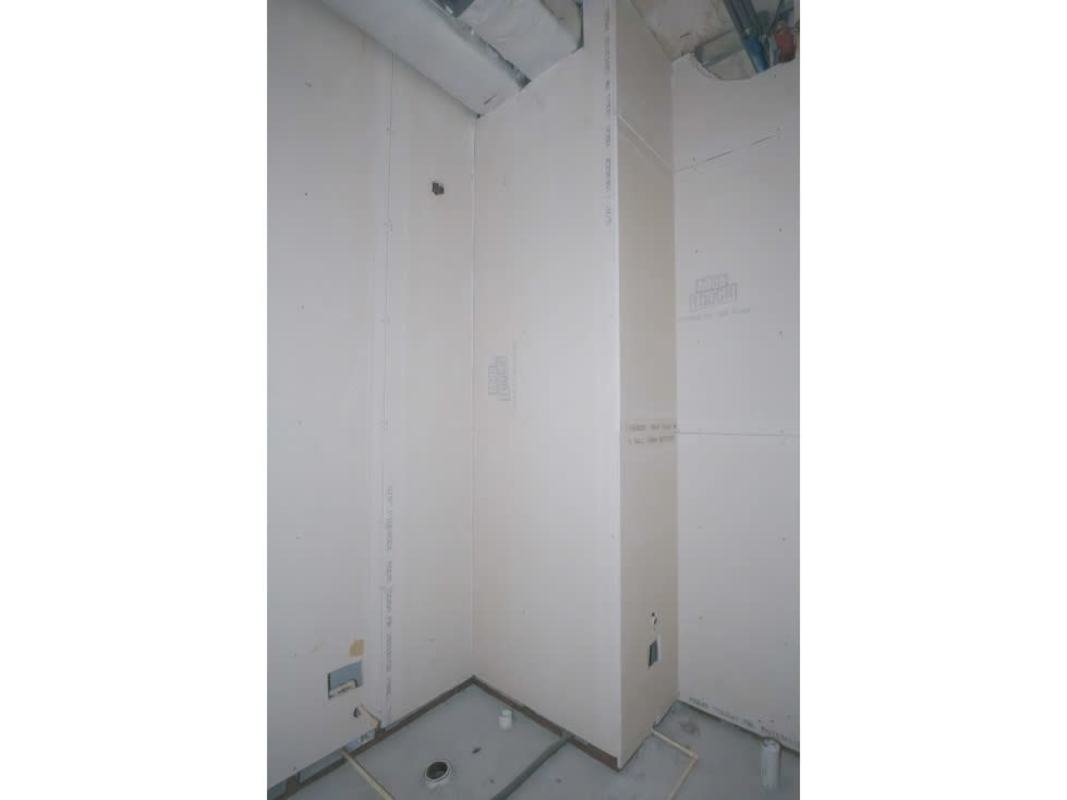 City skyline seen through large glass window of unfinished office space in PH Twist Tower Obarrio Panama City