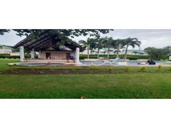 Bedroom with high ceilings and large windows overlooking Royal Decameron Villas in Rio Hato Panama