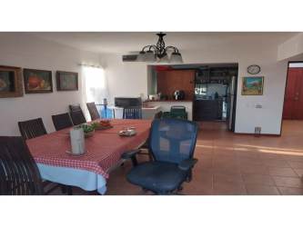 Covered terrace of villa with hammock facing Mantarraya Golf Course Decameron Resort Panama