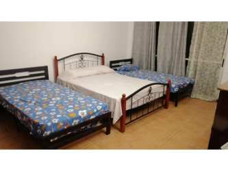 Spacious living room with sofas and entertainment area in duplex villa Decameron Beach Resort Panama