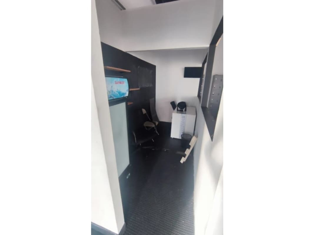 Workout zone with large tires, barbells, boxing mural gym rental Plaza 75 San Francisco