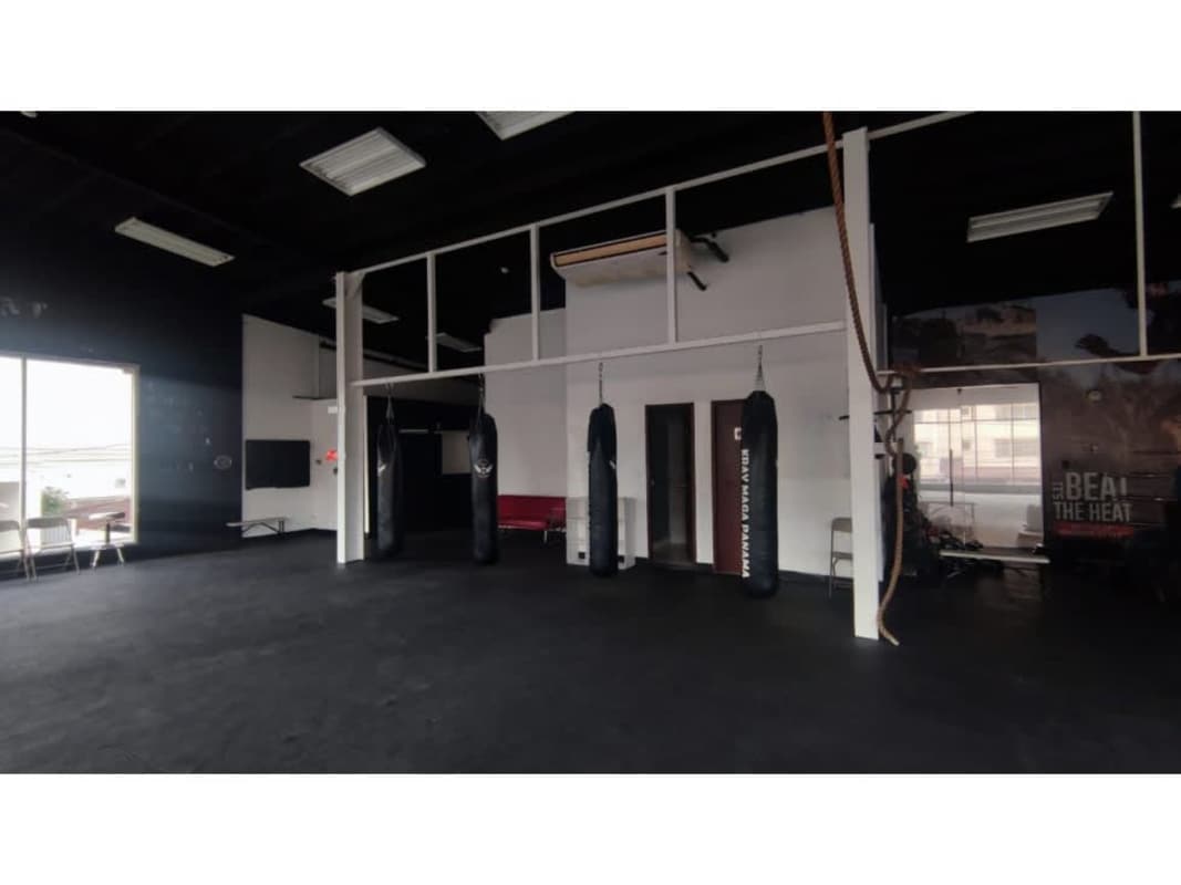 Spacious open commercial gym space with large windows in Plaza 75 San Francisco