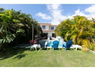 Mediterranean style backyard terrace with pool and palm trees Casamar resort Panama