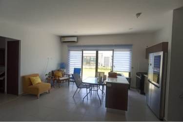 Spacious living and dining area with tile floors, split AC and garden views in Playa Blanca Costa Blanca Villas