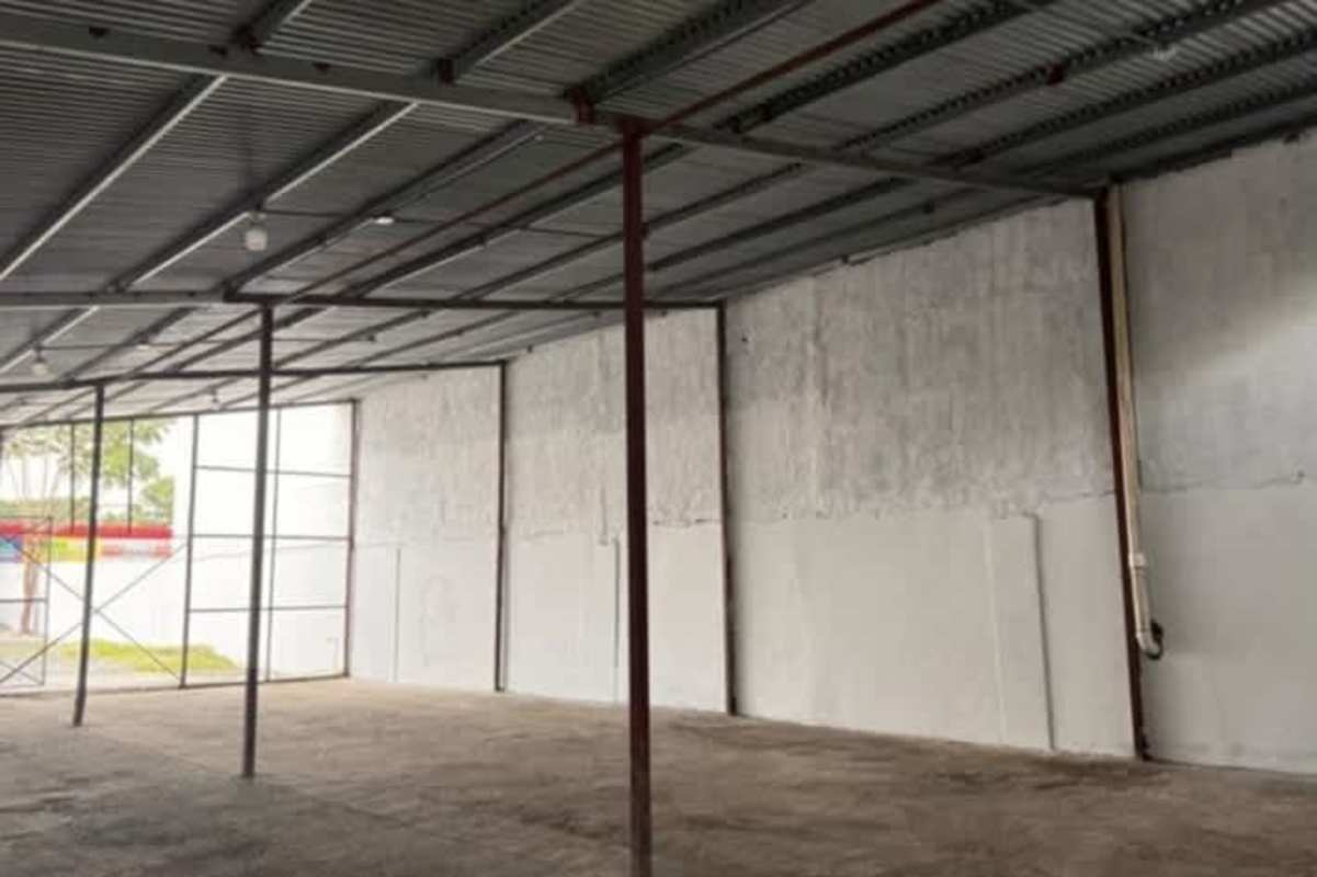 Elevated metro station near commercial warehouse with canopy roof and highway access in 24 de Diciembre Panama